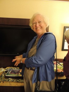 Connie Willis displaying one of the Glory Road cakes