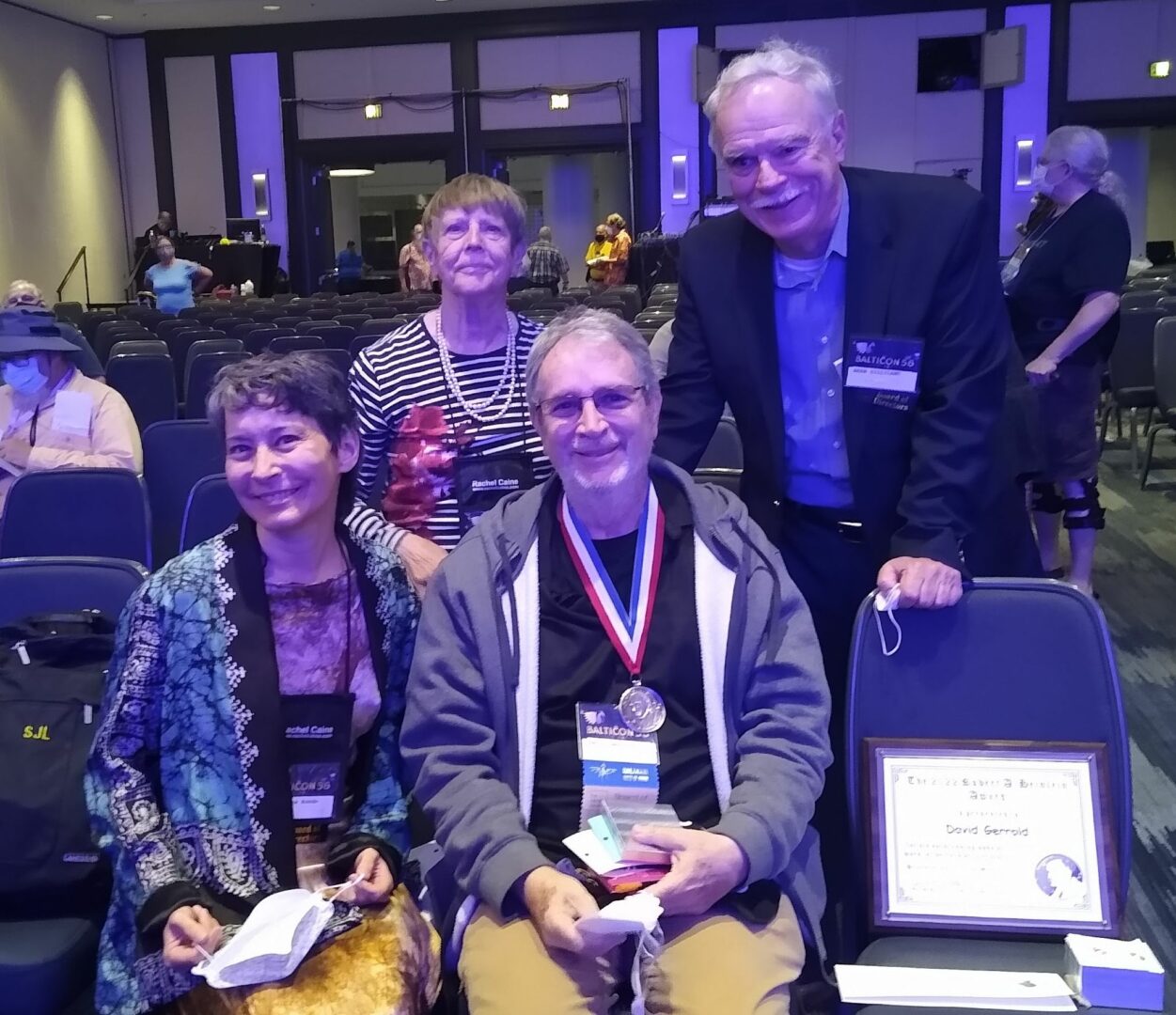 L-R Dr. Beatrice Kondo, Treasurer, THS, Mrs. Ursula Kondo, THS member and direct benefactor to the Heinlein Award, 2022 Awardee David Gerrold, and Dr. Herb Gilliland, THS Secretary and Editor of _The Heinlein Journal_